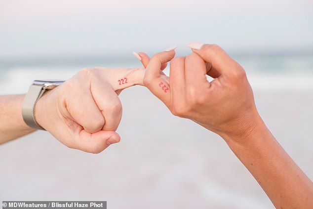 Bond: Seven months after they met, the couple cemented their bond by getting matching '222' tattoos on their fingers